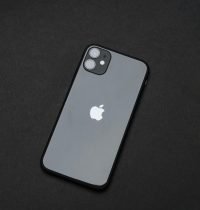 An elegant smartphone on a dark background, emphasizing modern tech design.